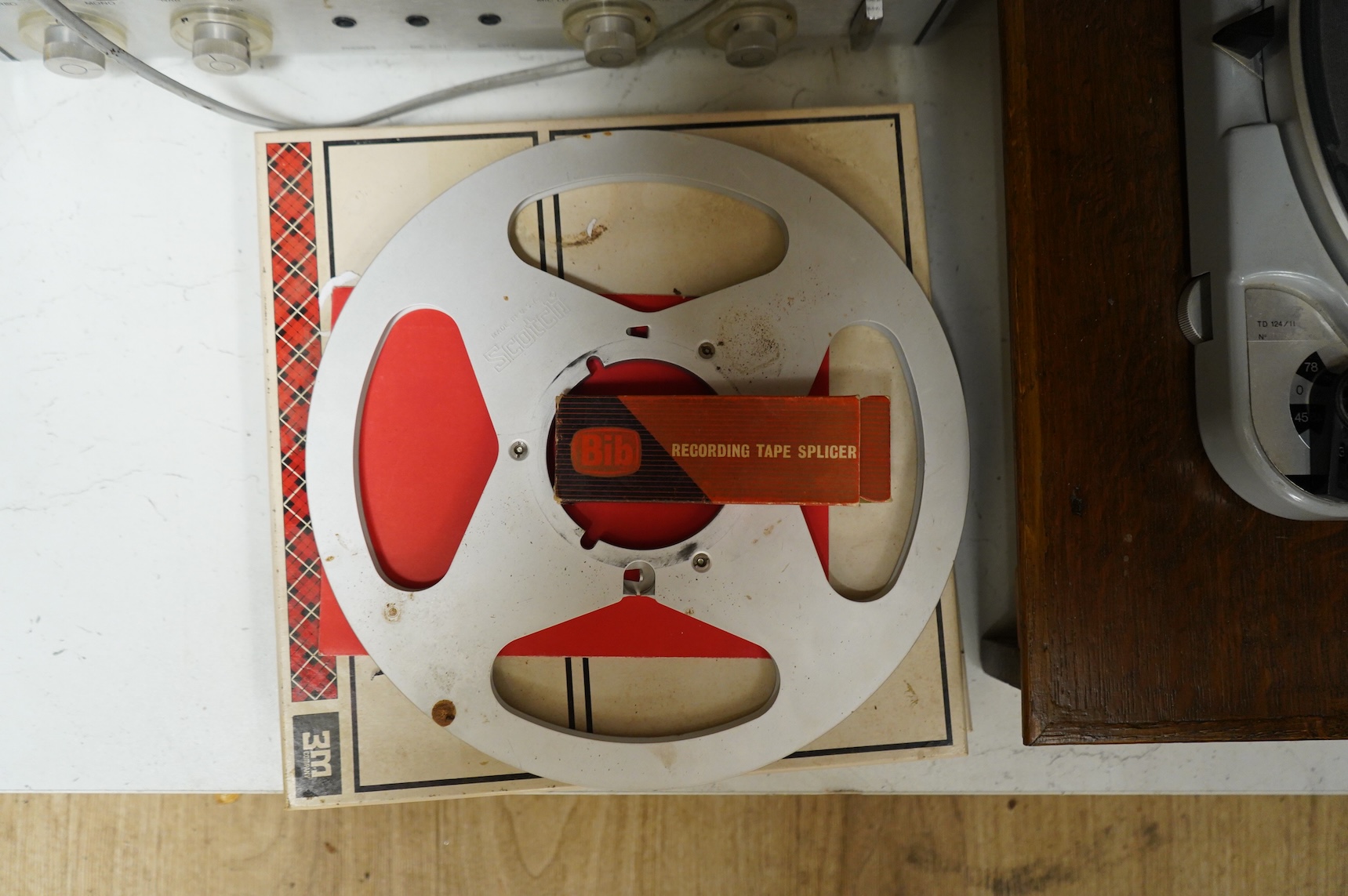 A Revox reel to reel Tape Recorder A77, with instruction booklet and tape, together with a Thorens TD 124/11 turntable record player, plus a pair of Lowther EX3 speakers contained within home-made cabinets